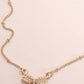 Gold plated pearl bow necklace