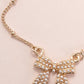 Gold plated pearl bow necklace